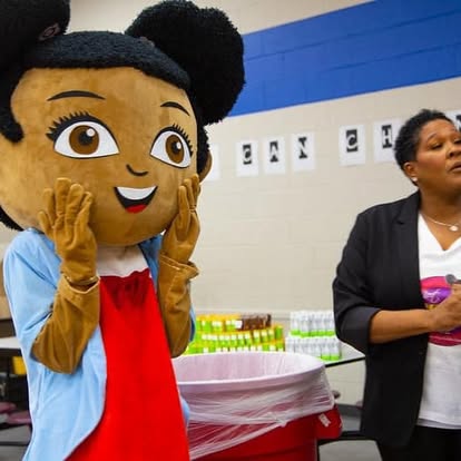Mya mascot interacting with children in educational setting