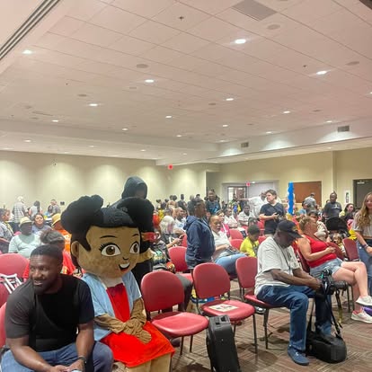 Mya mascot at community or school event with families